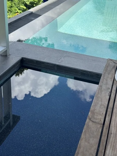 Villa Tantawan Resort — the dark pond around the sala, beside the pool