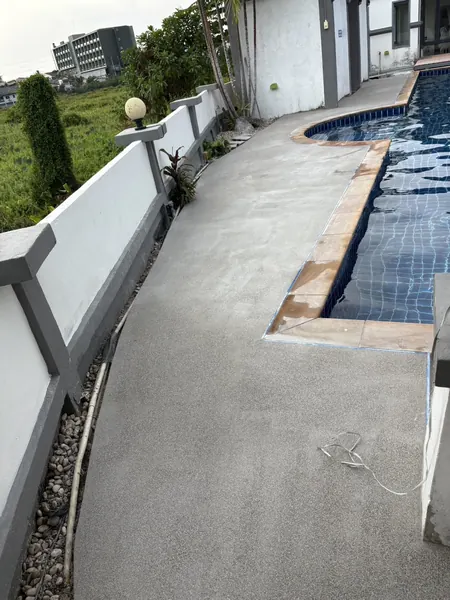 Village Clubhouse — Pool Deck — the fresh finish along the pool edge