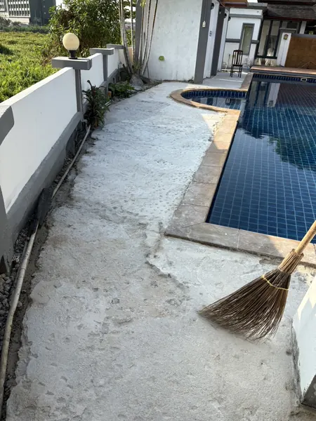 Village Clubhouse — Pool Deck — the old surface stripped by the pool
