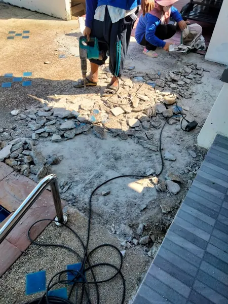 Village Clubhouse — Pool Deck — breaking out the old surface