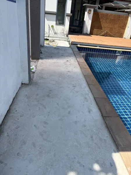 Village Clubhouse — Pool Deck — the walkway along the pool before the works