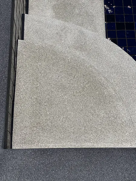 Vista del Mar, Naithon — Sea-View Pool — the curved steps in PebbleCrete Classic Granite