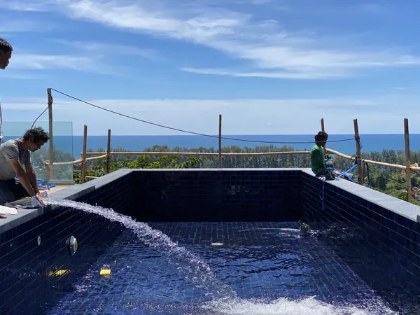 Vista del Mar, Naithon — Sea-View Pool — filling the pool, with the sea beyond