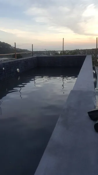 Vista del Mar, Naithon — Sea-View Pool — the new coping at dusk