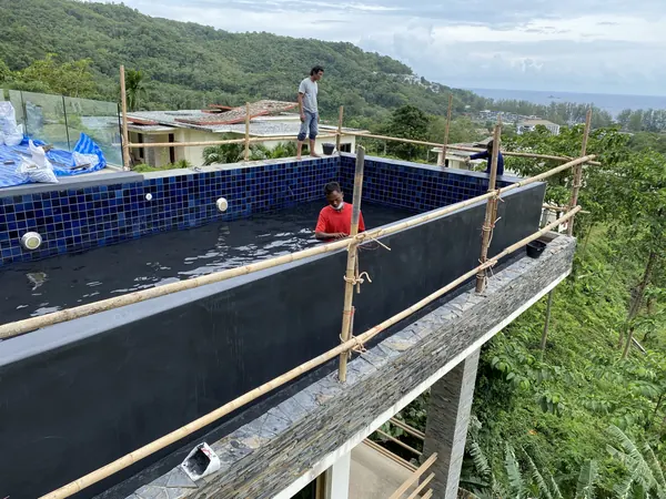 Vista del Mar, Naithon — Sea-View Pool — working on the outer wall over the slope