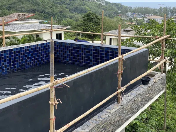 Vista del Mar, Naithon — Sea-View Pool — the outer wall of the pool above the slope