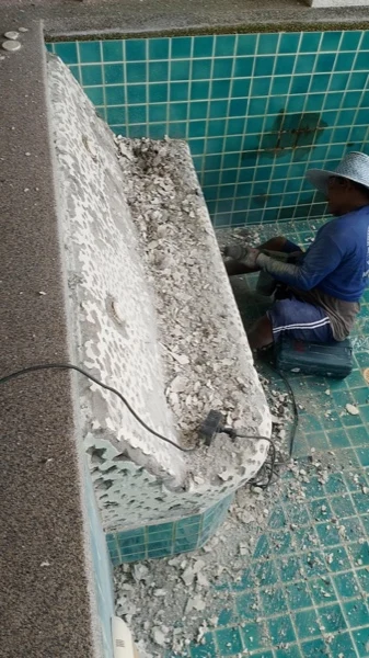Wyndham Grand Phuket Kalim Bay — grinding the old lounger surface back