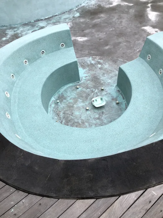 Zima Spa & Wellness — an empty jacuzzi part of the main pool showing the installed surface